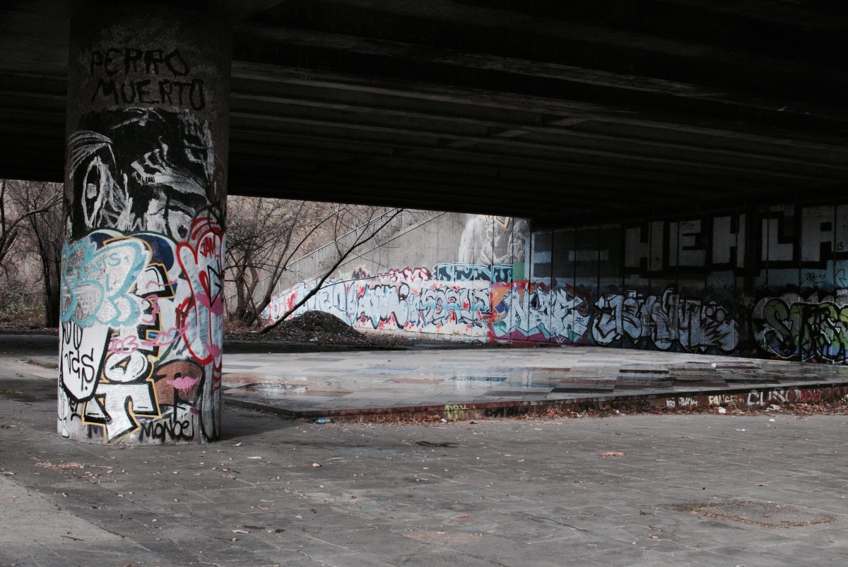 Cybergoth dance function under a bridge